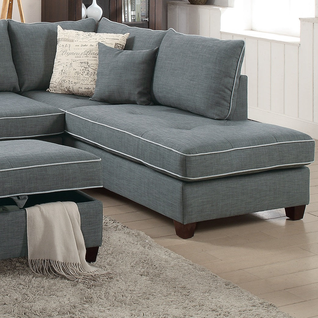 Modern gray sectional sofa with white piping and accent pillows for a stylish living room