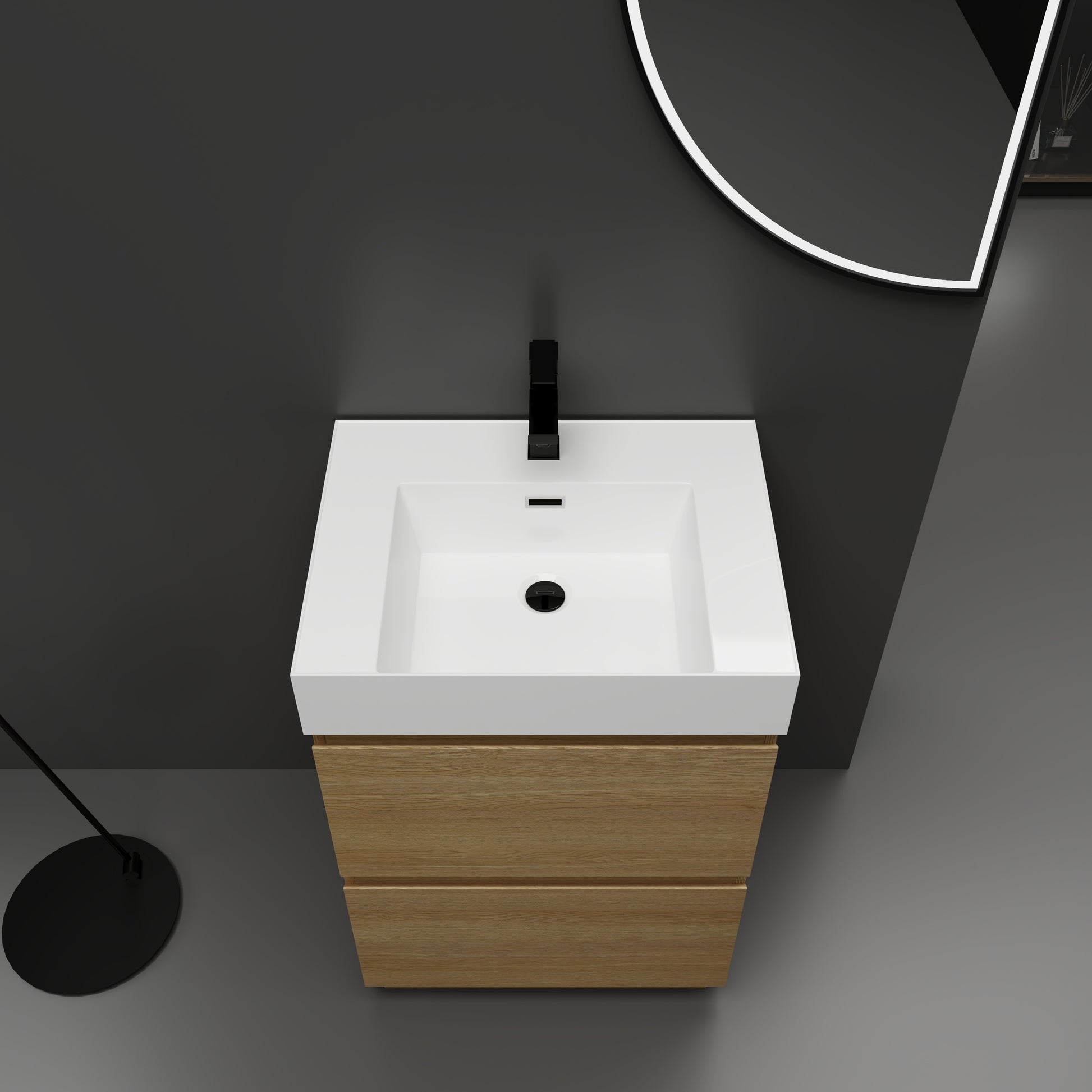Modern white rectangular vanity sink with a matte black faucet and light oak wood cabinet