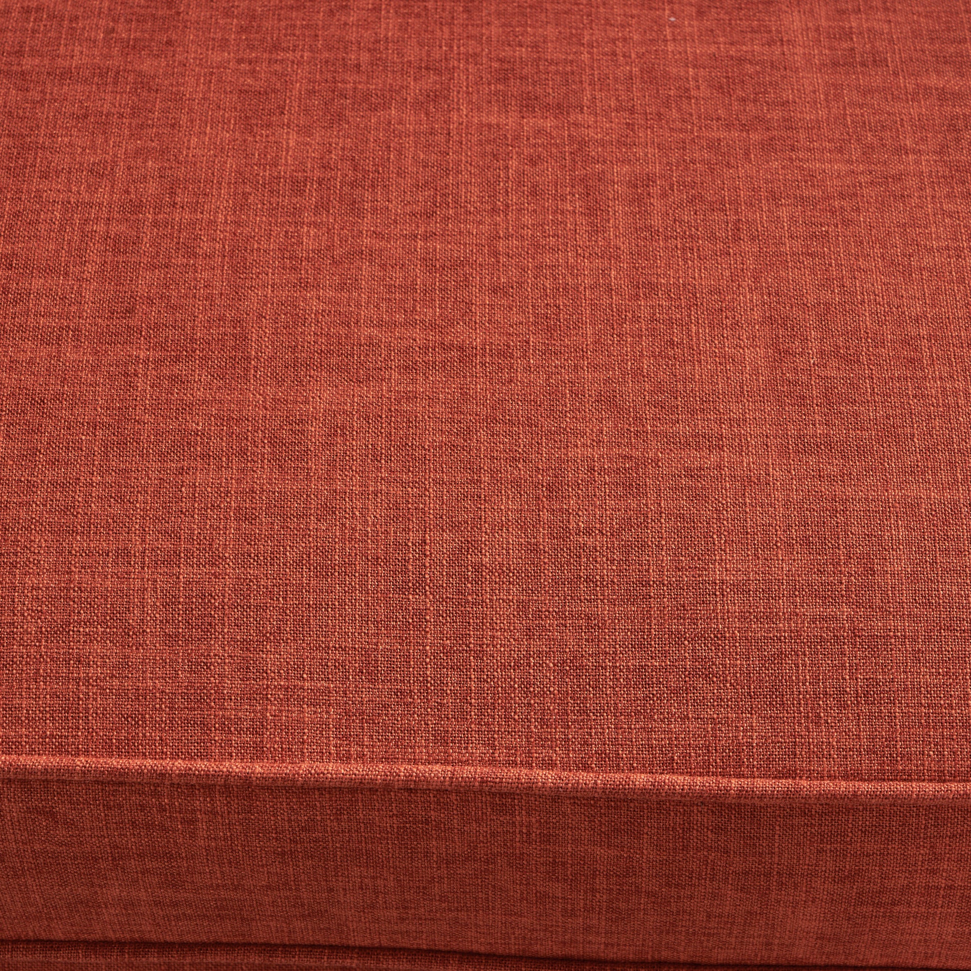 Closeup of textured terracotta linen fabric ideal for upholstery and home decor projects
