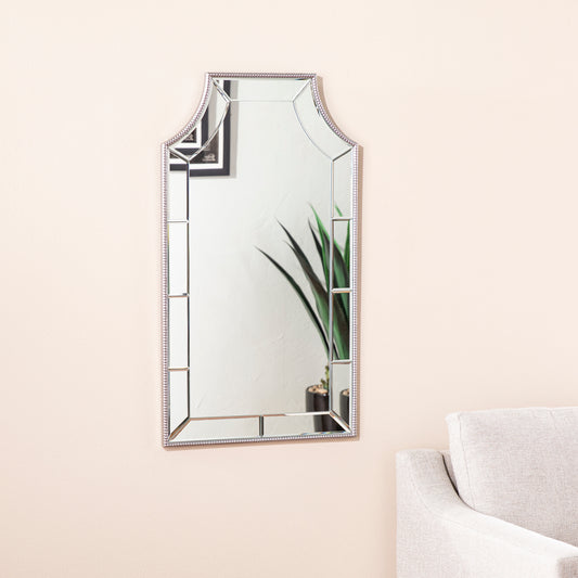 Decorative ornate mirror with silver beaded frame and beveled glass panels