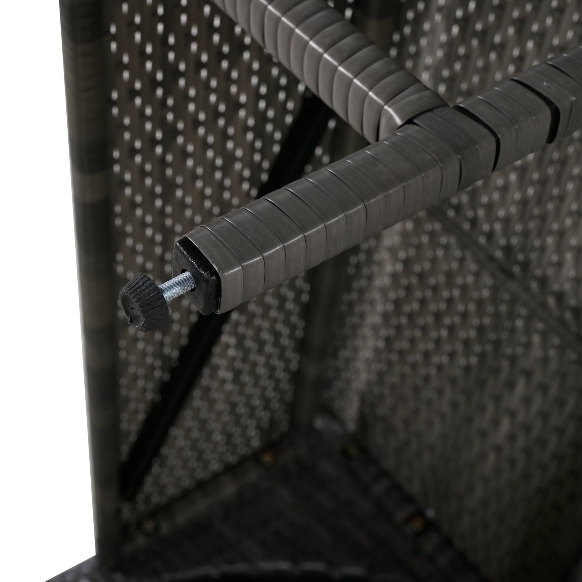 Closeup of a grey rattan furniture leg with adjustable foot for stability