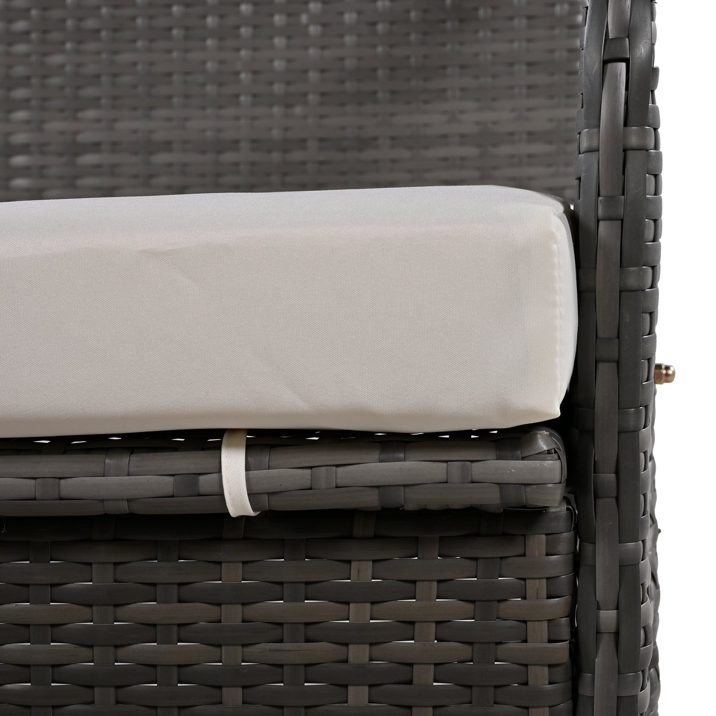 Closeup of dark gray wicker sofa cushion and woven frame