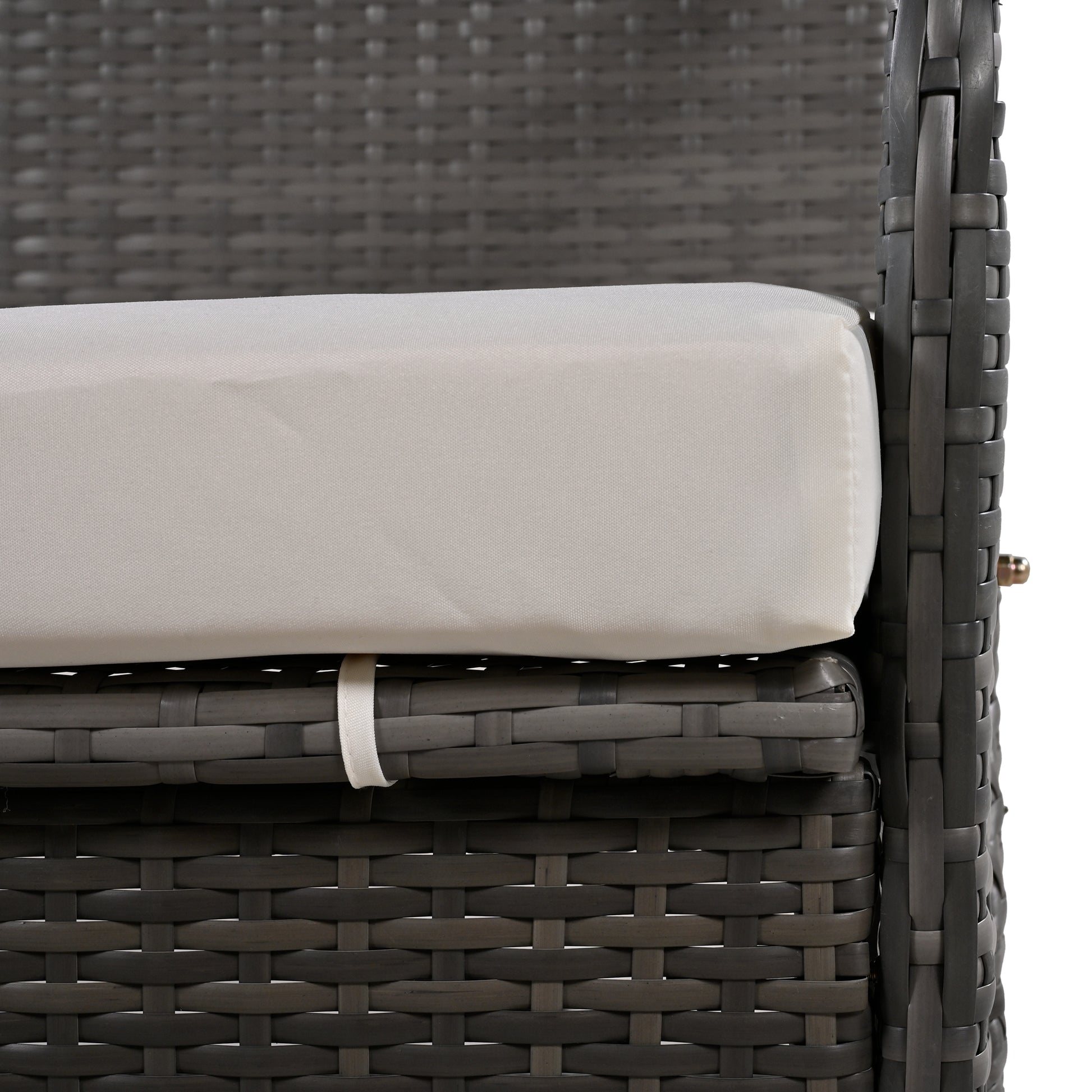 Closeup of dark gray wicker sofa cushion and woven frame