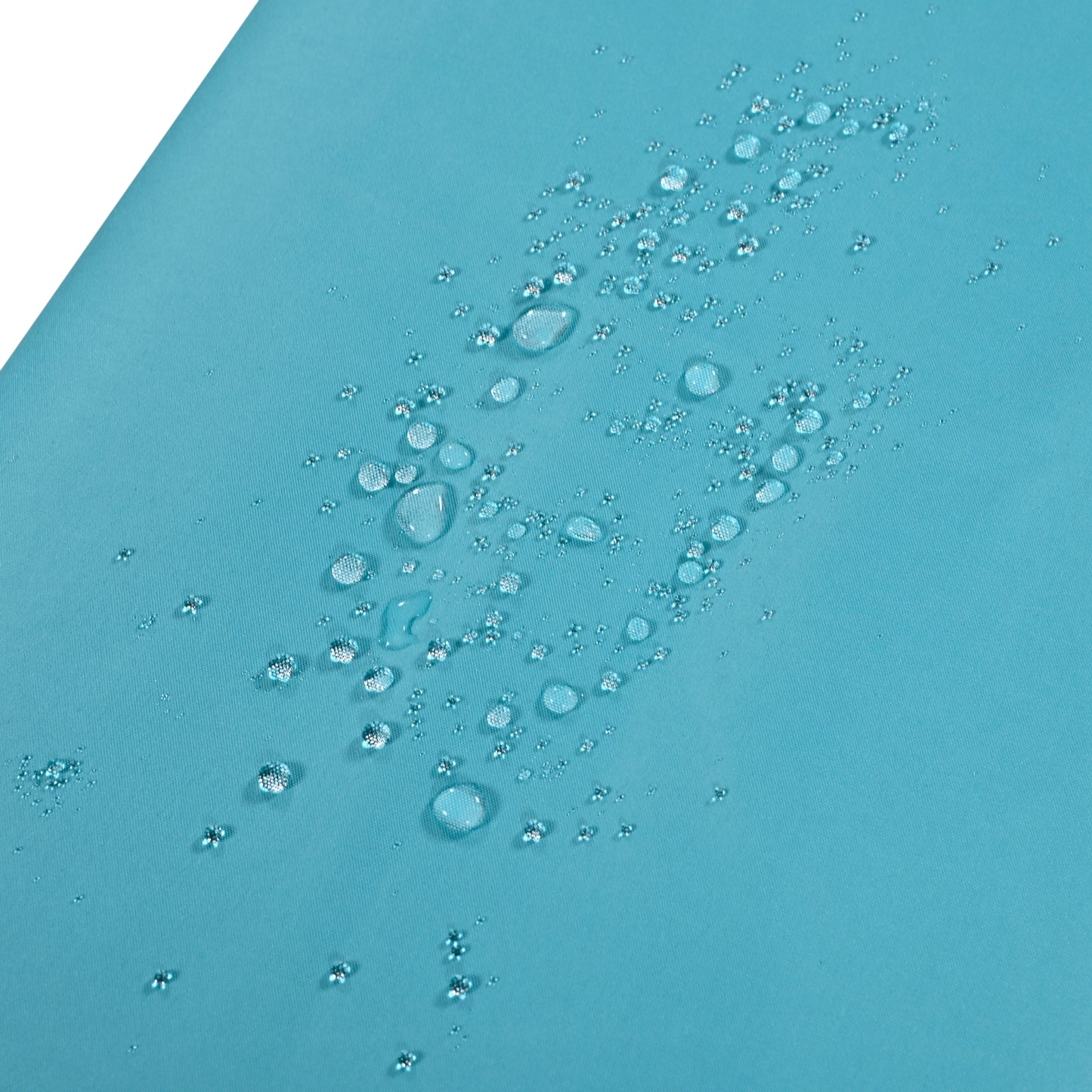 Teal fabric with water beads showcasing its waterproof properties