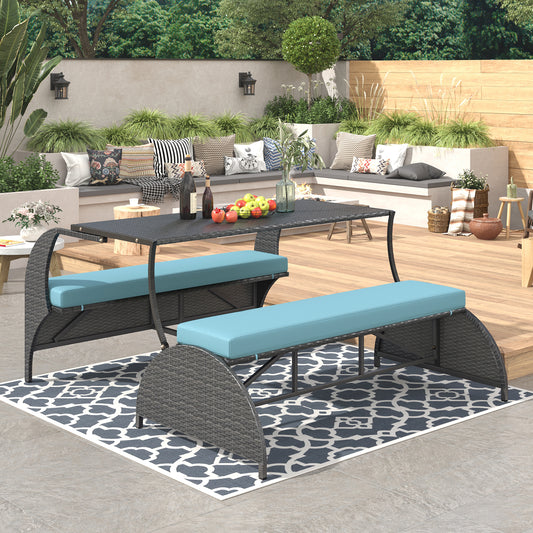 Gray wicker outdoor dining set with blue cushions and glass tabletop for patios