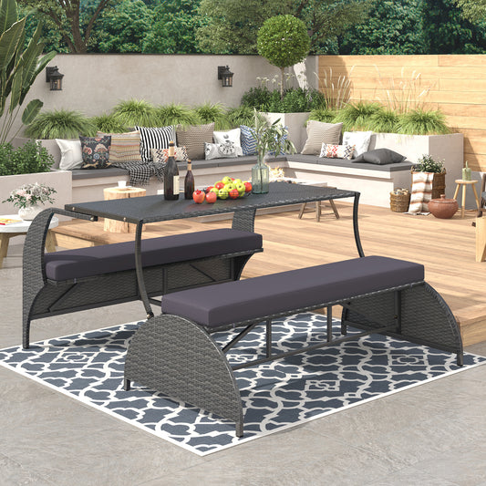 Gray wicker outdoor dining set with dark gray cushions and glass top table