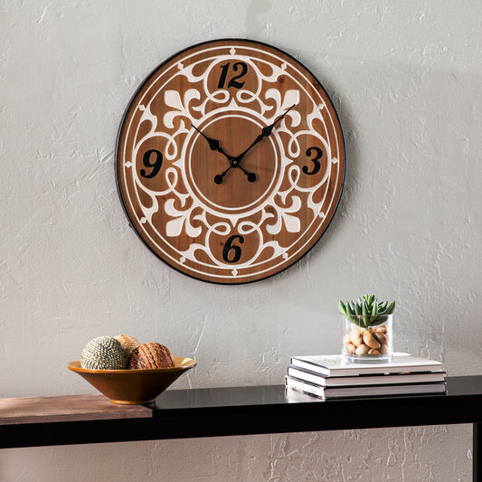 Ornate brown wood wall clock with white decorative overlay and black numerals
