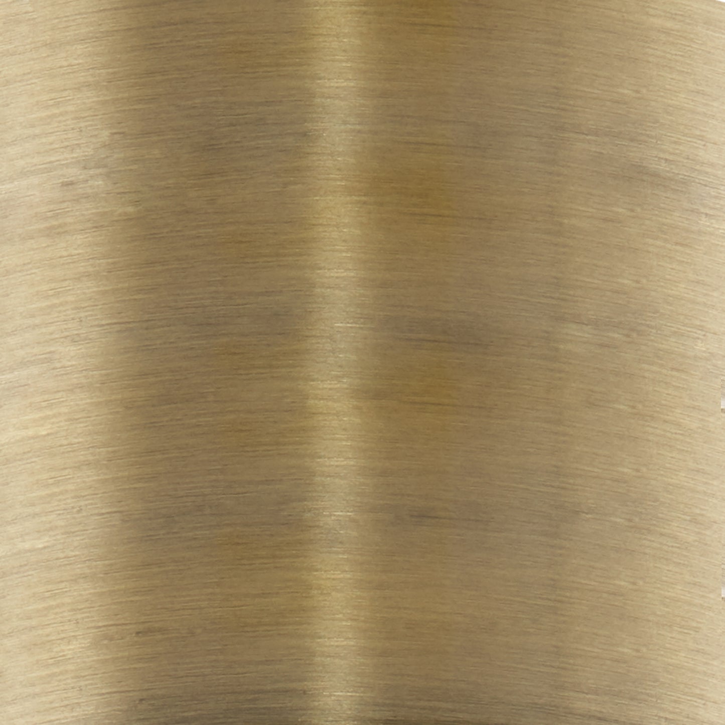 Brushed brass finish showcasing subtle horizontal grain detail on a metal sheet