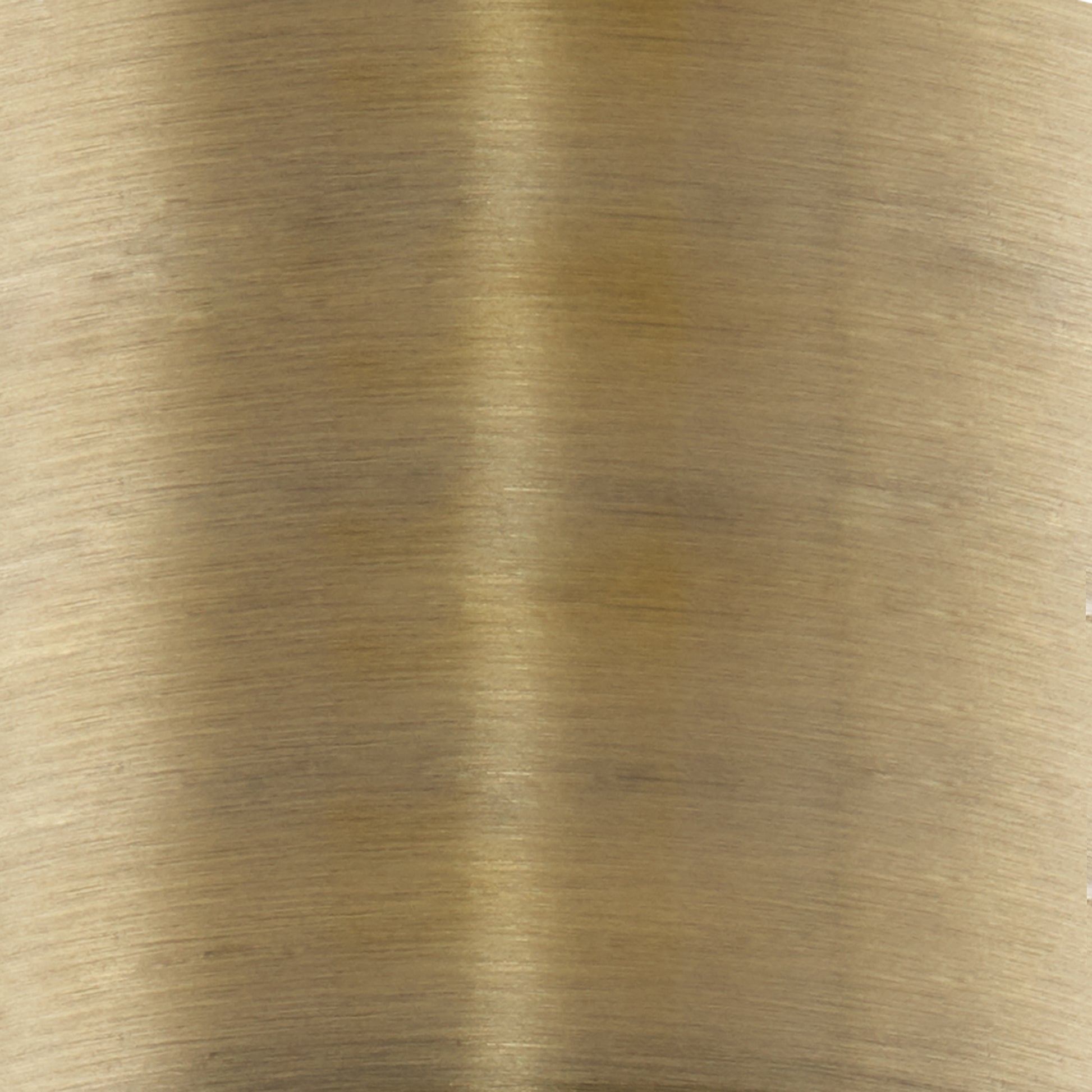 Brushed brass finish showcasing subtle horizontal grain detail on a metal sheet