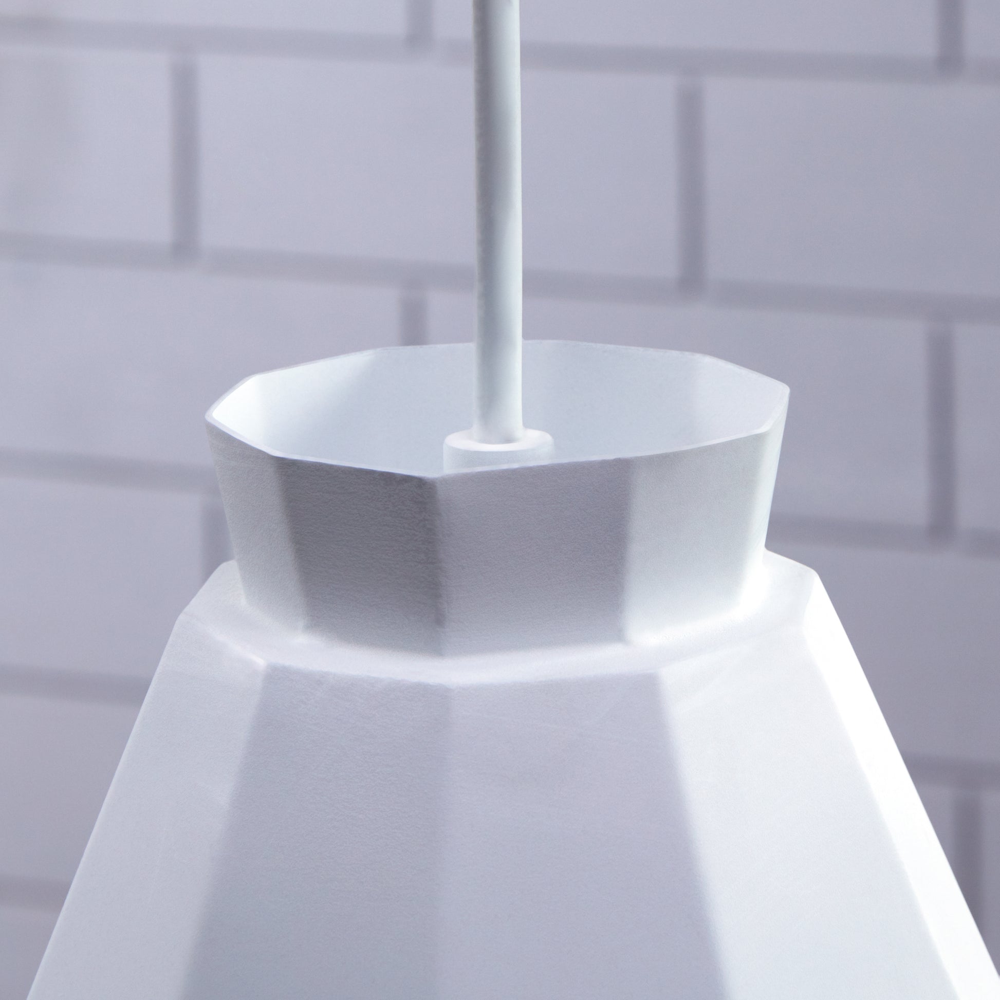 Modern white pendant light with geometric design ideal for contemporary kitchen islands