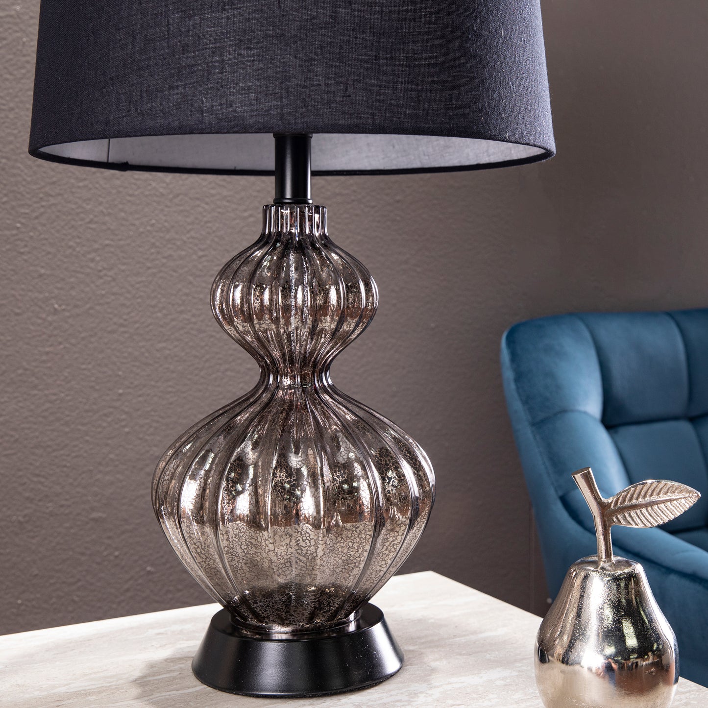 Elegant mercury glass table lamp with black linen shade and ribbed base