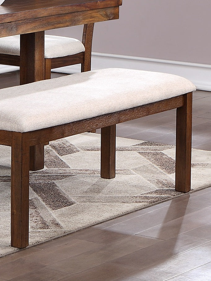 Upholstered dining bench with wood frame and neutral fabric seat