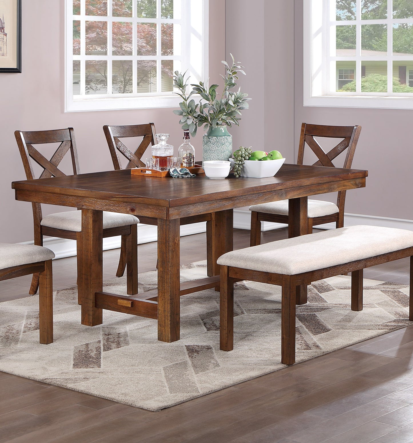 Rustic oak dining table with crossback chairs and upholstered bench