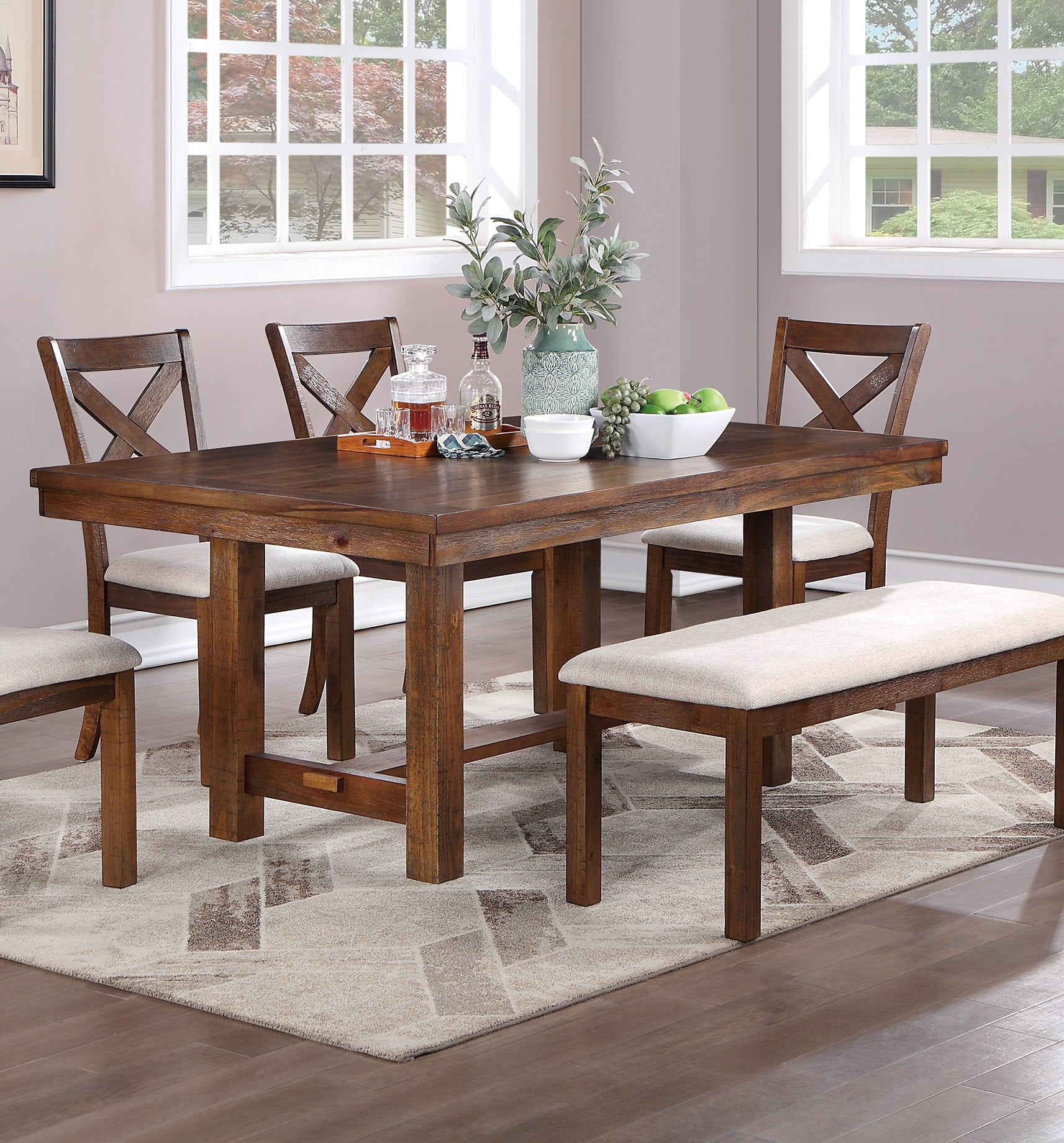 Rustic oak dining table with crossback chairs and upholstered bench