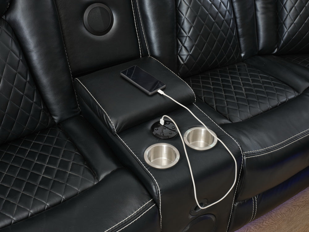Black leather recliner sofa with diamond stitching cup holders and integrated USB charging port