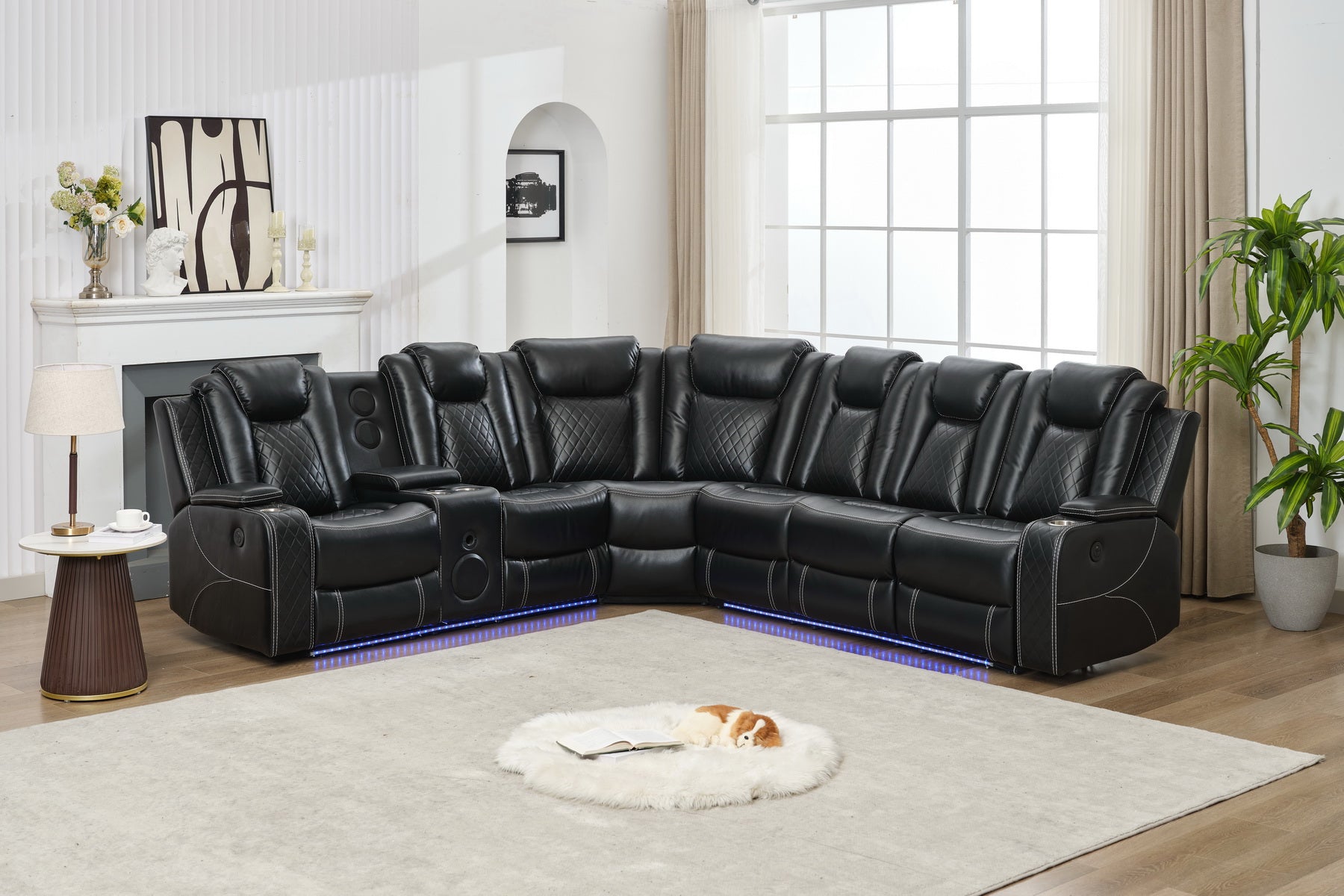 Black leather sectional sofa with diamond stitching cup holders and LED lighting