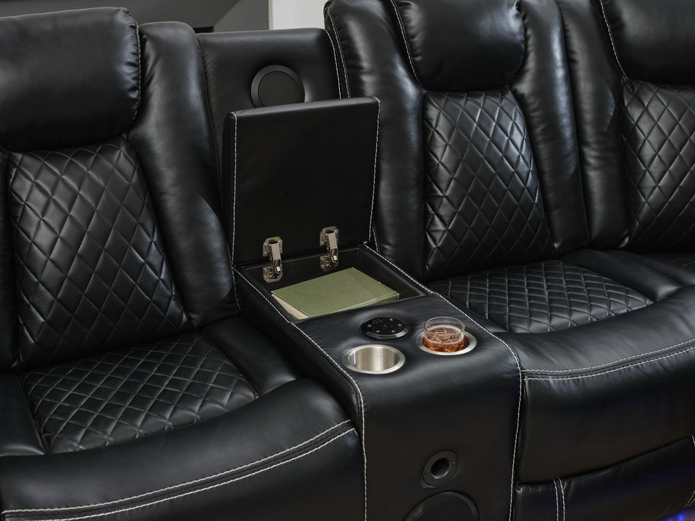 Black leather reclining sofa with diamond stitching and builtin cup holders
