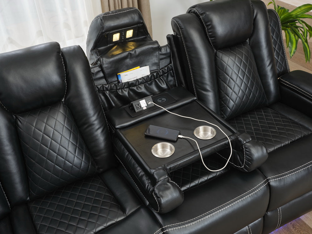 Black leather recliner with diamond stitching cup holders and integrated charging station