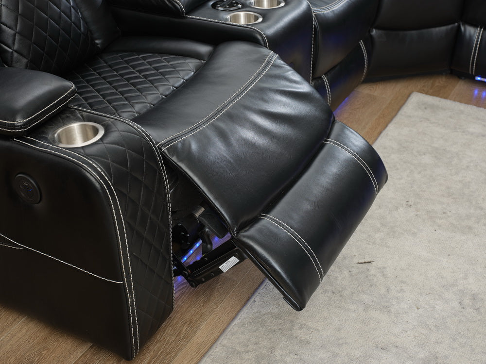 Black leather recliner chair with diamond stitching and cup holder