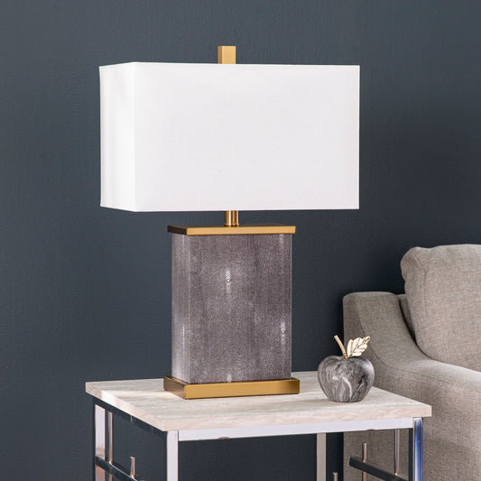 Rectangle lamp with gray textured base and white shade on end table