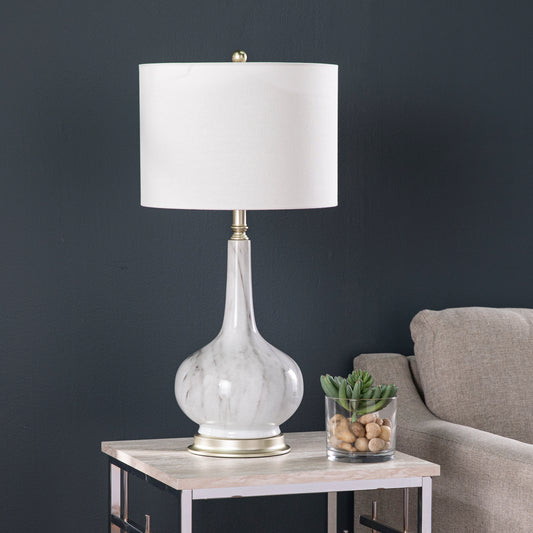 Elegant marble table lamp with a white linen shade and brushed gold base for sophisticated living rooms