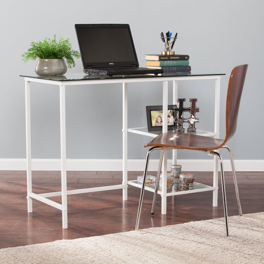 Sleek white metal desk with glass top and integrated shelf ideal for home office