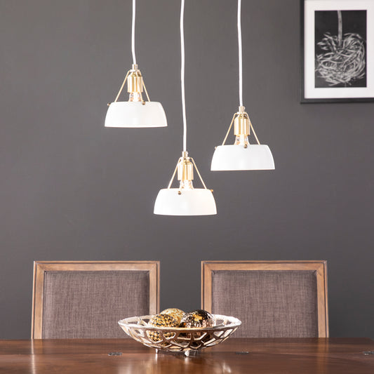 White and gold pendant light fixture with a modern minimalist design for dining room lighting