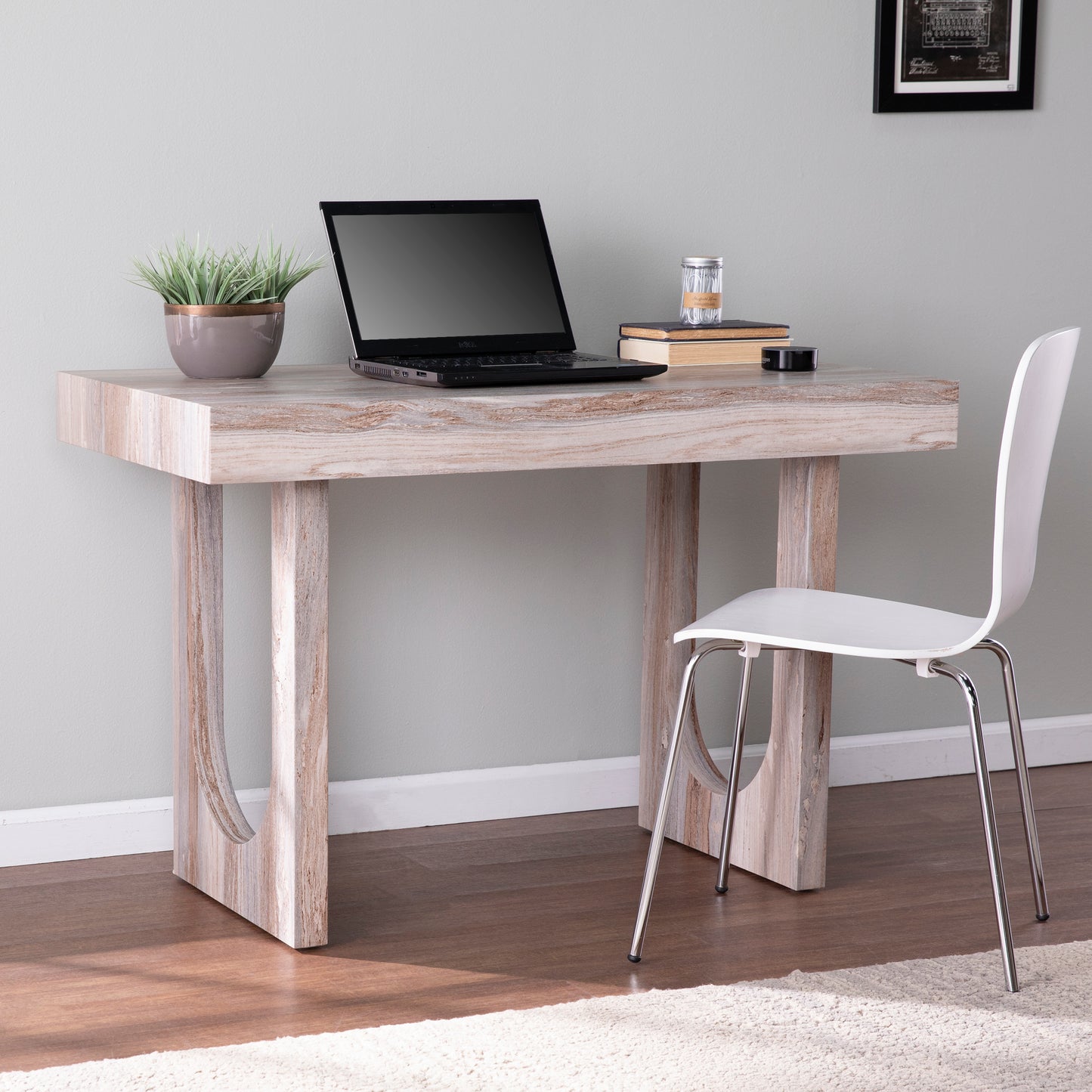 Modern writing desk with distressed wood finish and sleek white chair