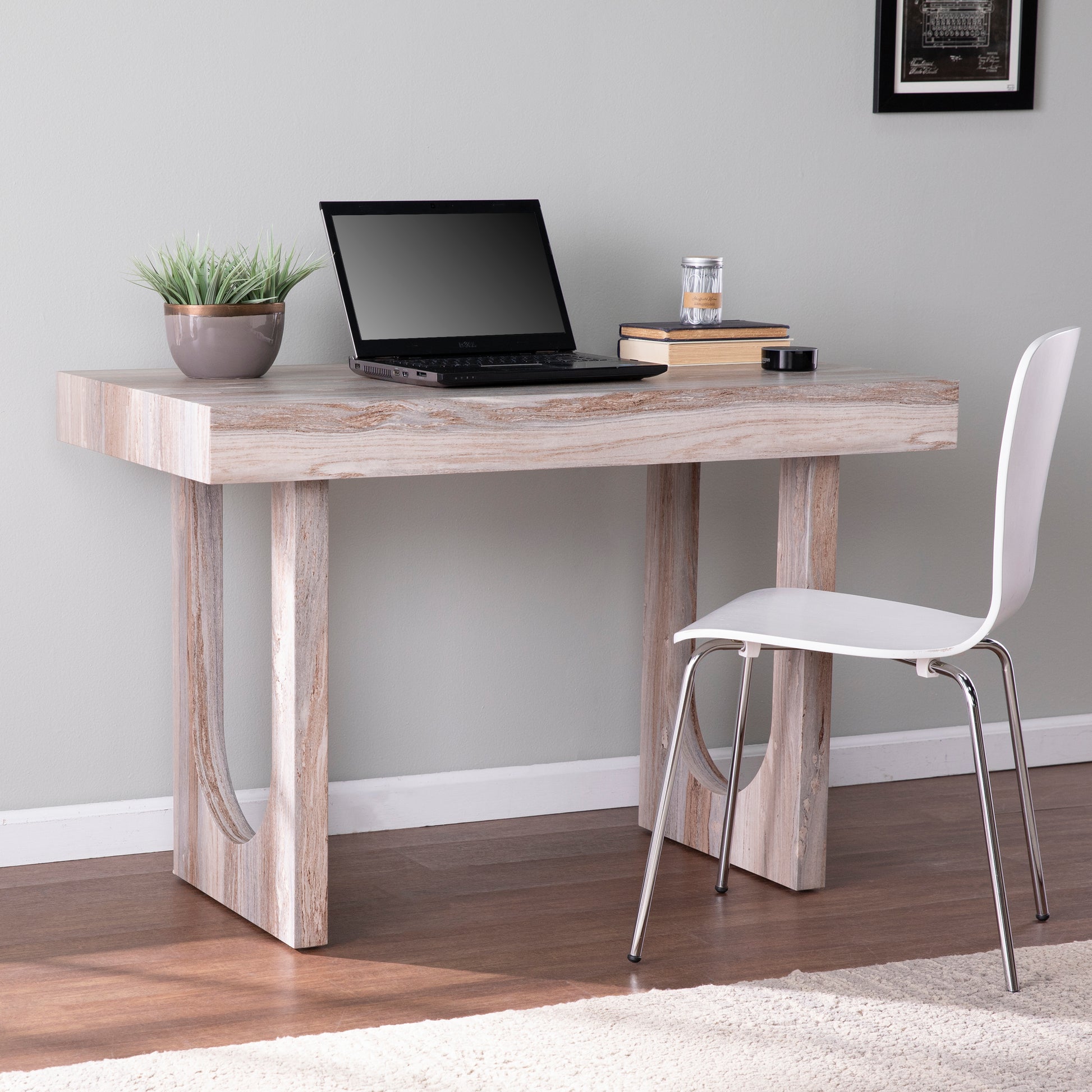 Modern writing desk with distressed wood finish and sleek white chair