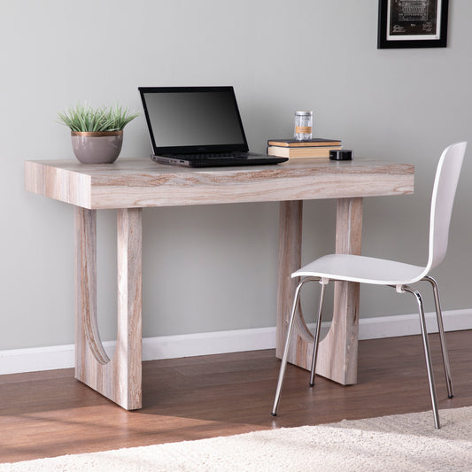 Modern writing desk with distressed wood finish and sleek white chair