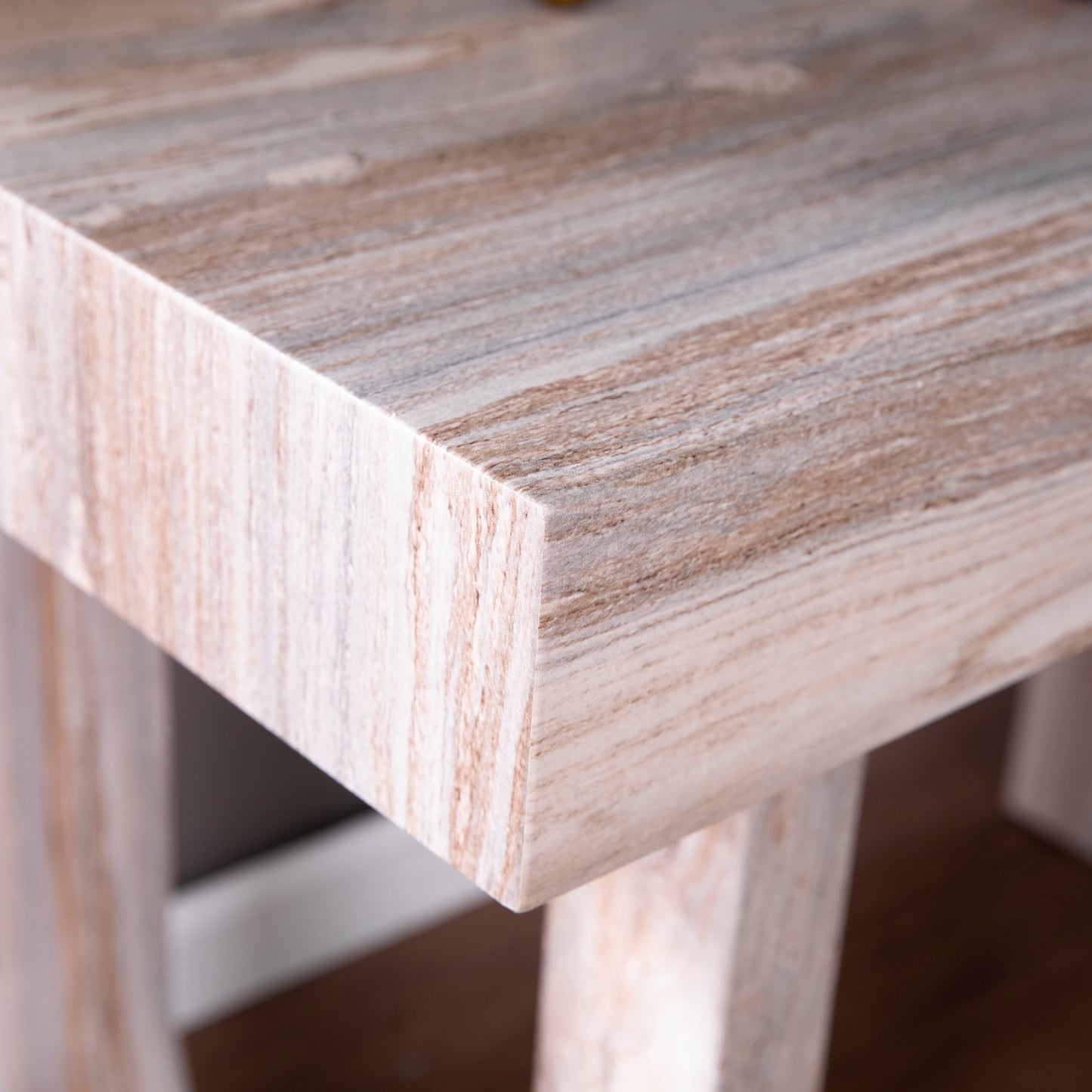 Closeup of a light wood grain side table with a smooth finish