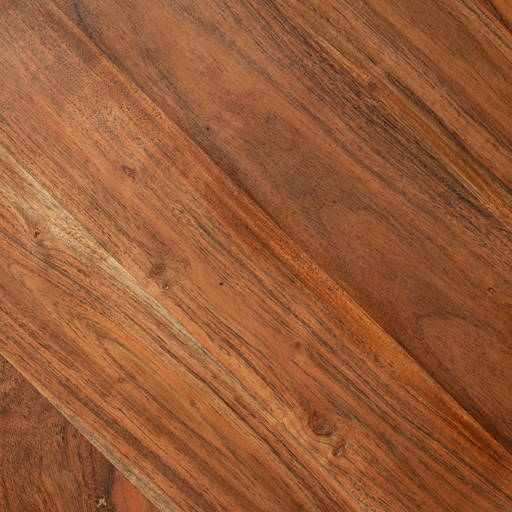 Closeup of rich brown Acacia wood grain showing natural imperfections and warm tones for furniture