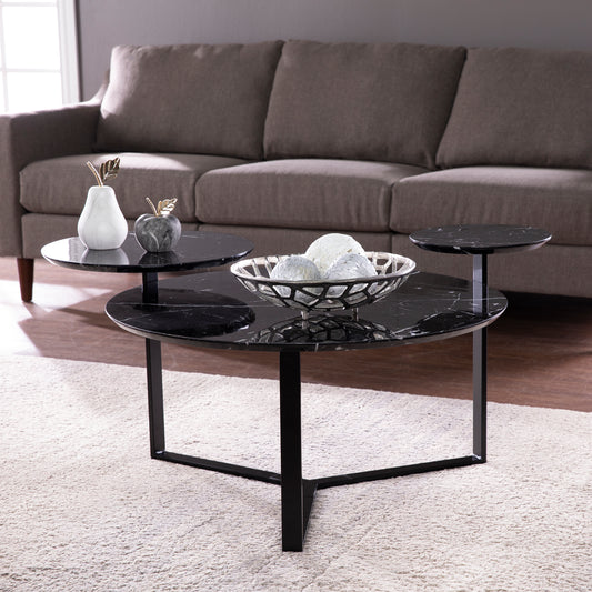 Modern tiered coffee table with black marble tops and metal legs