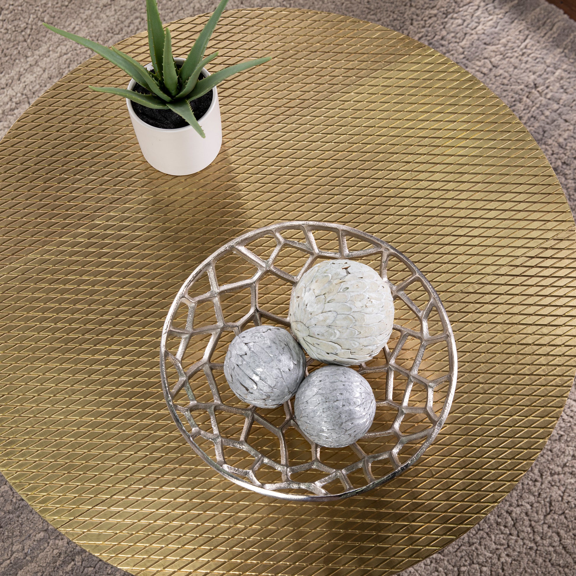 Set of  decorative accent spheres with white and grey marbled patterns in a silver filigree bowl