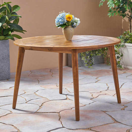 Round teak wood patio dining table with slatted top and tapered legs