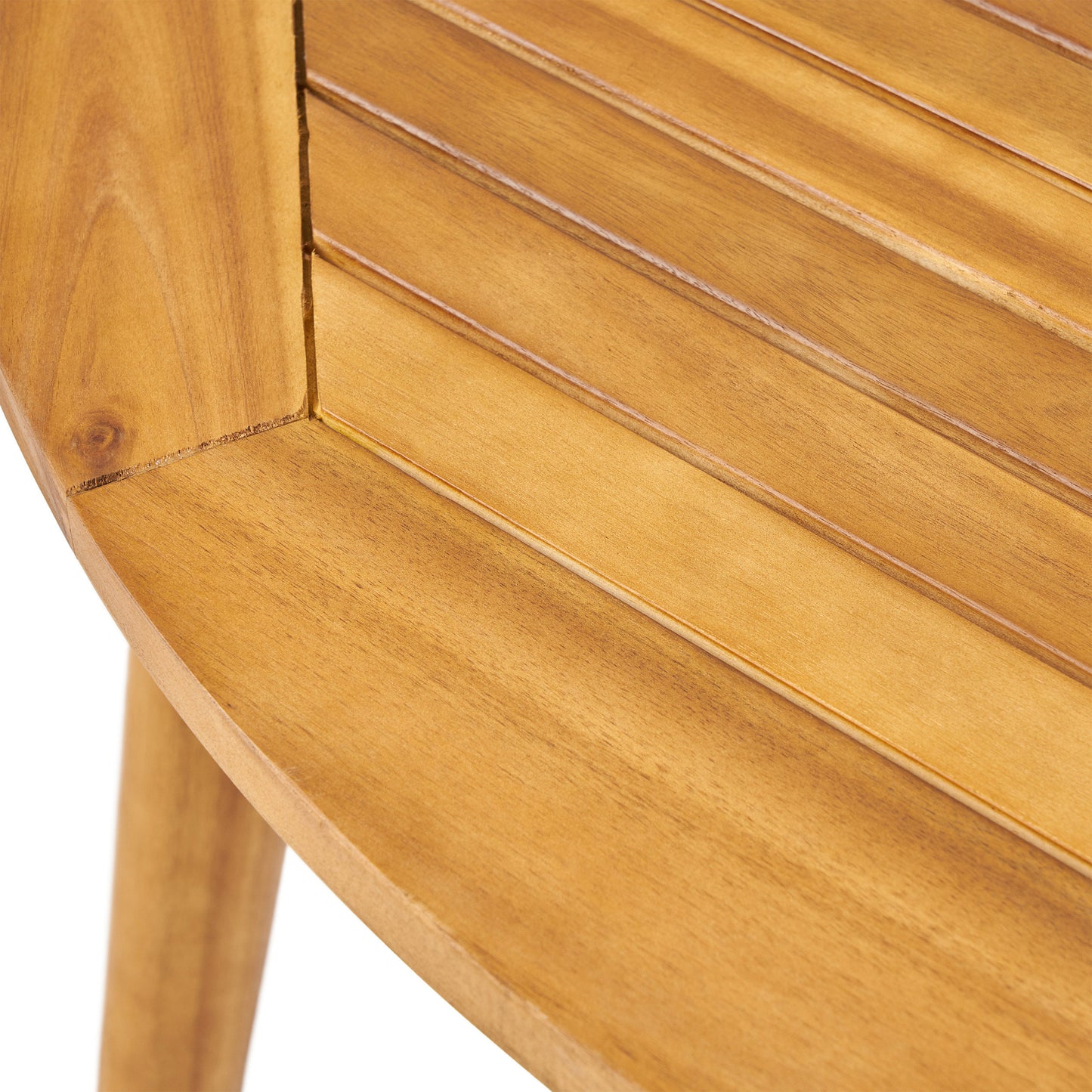 Close up of a natural wood round table featuring slatted detail and a light wood grain