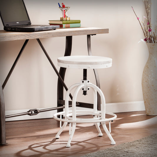 Adjustable height white industrial bar stool with distressed metal base