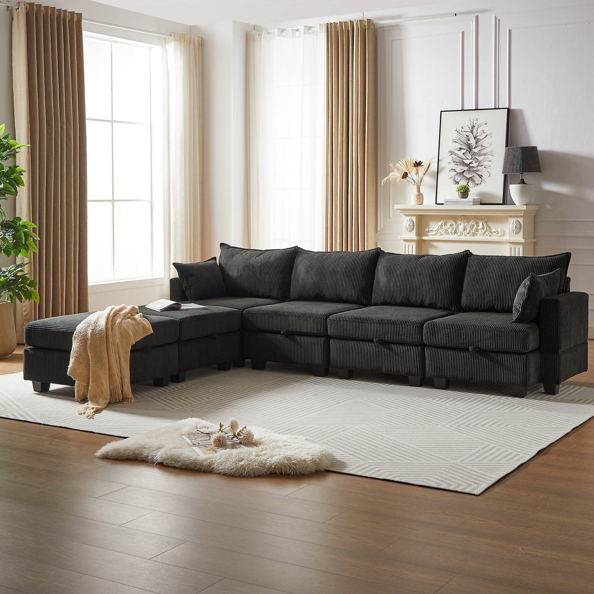Dark grey corduroy sectional sofa with chaise lounge and beige throw