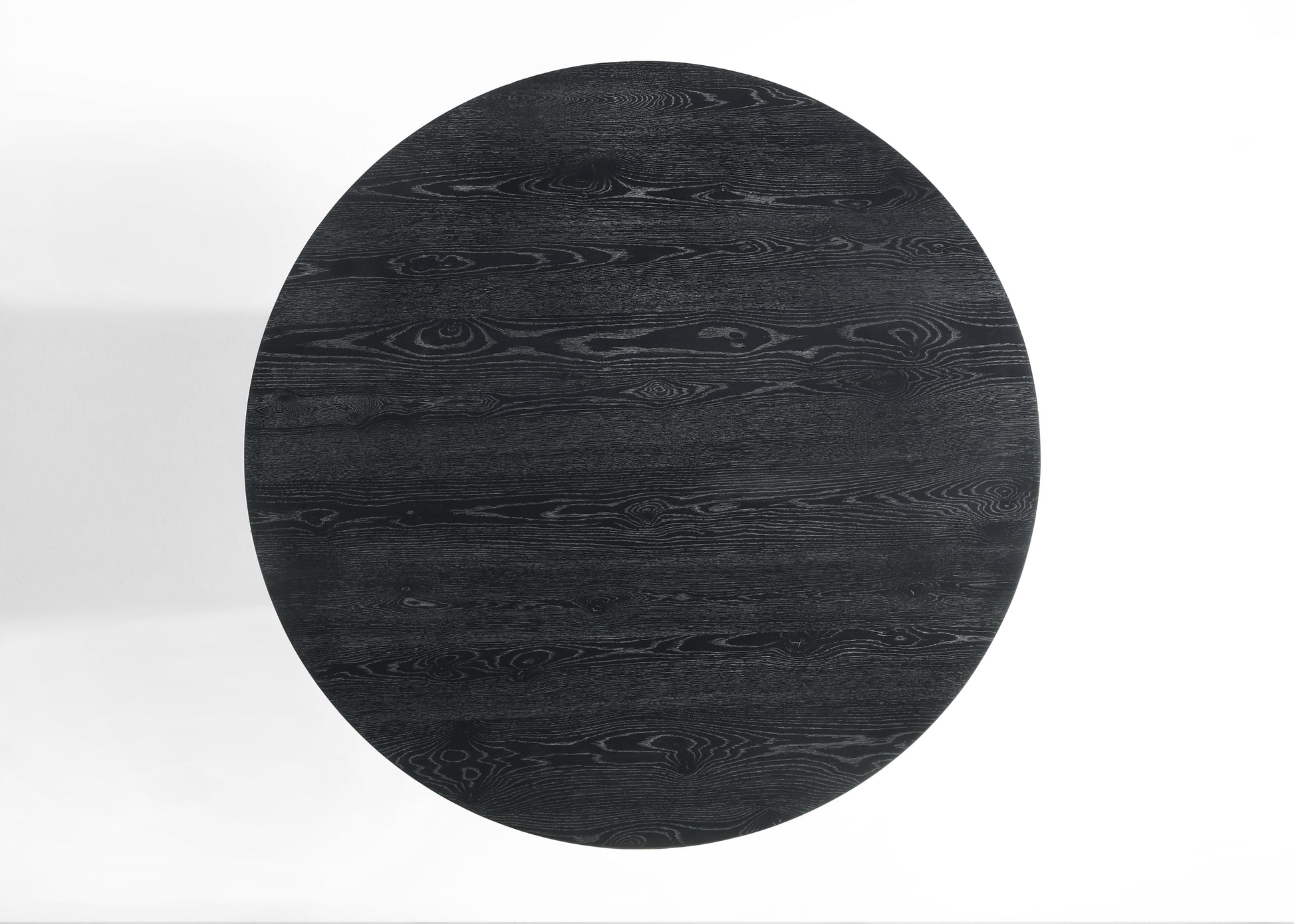 Black oval wood dining table top with prominent grain patterns