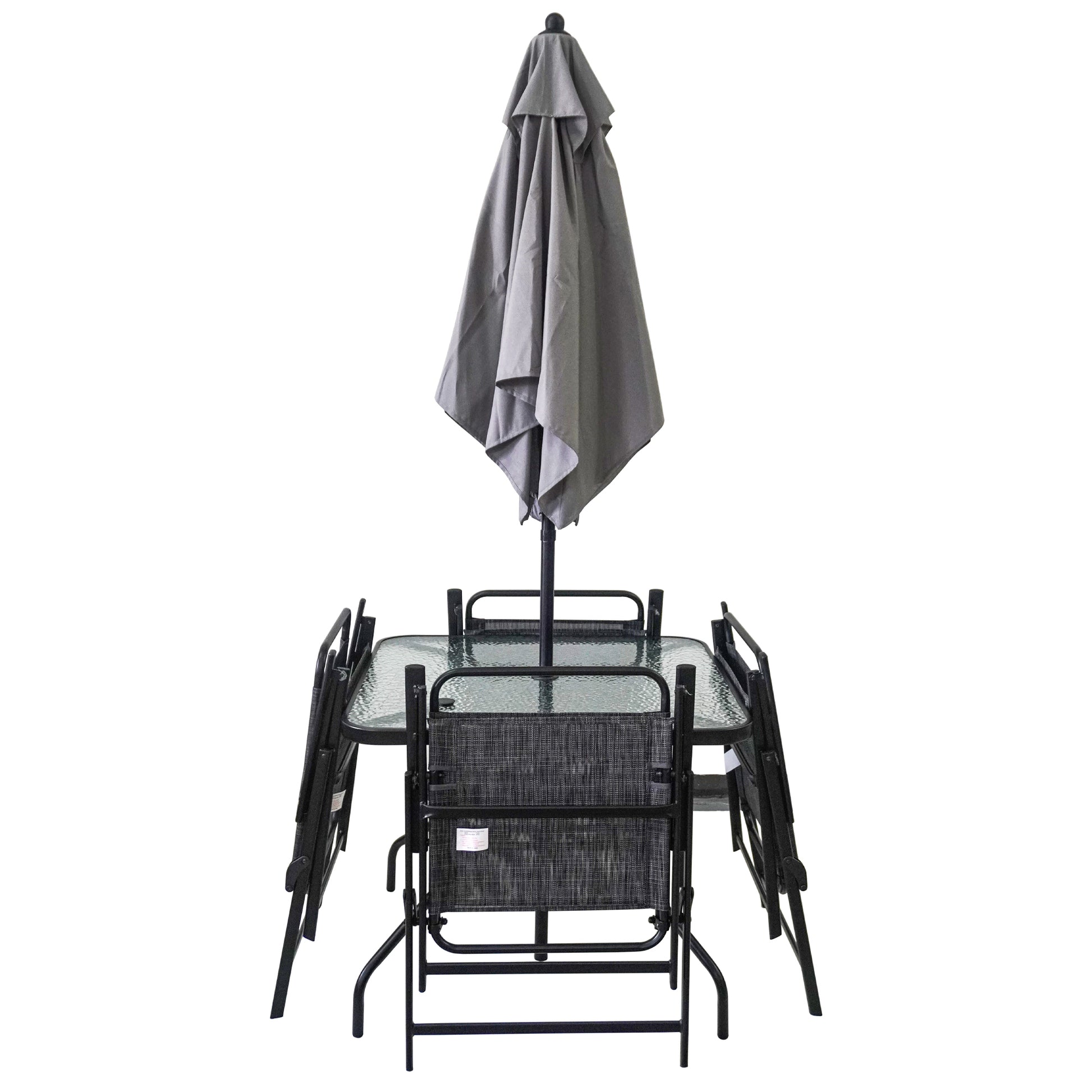 Glass top patio table with four folding chairs and closed grey umbrella