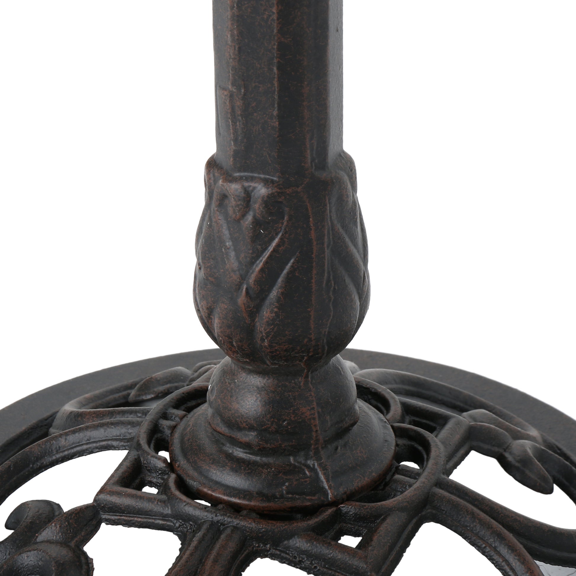 Ornate dark bronze metal table base with carved floral detailing on pedestal