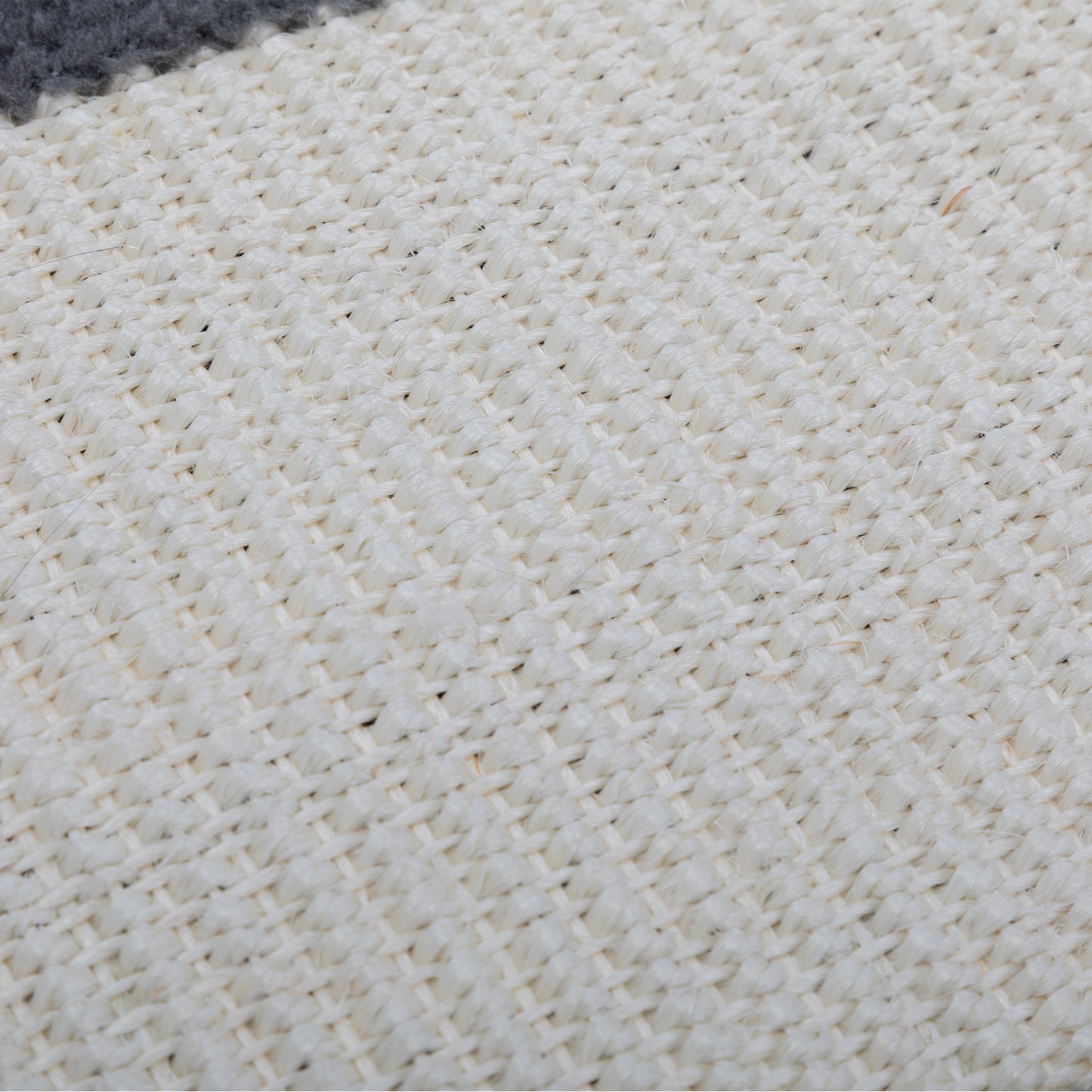 Close up of natural fiber rug texture in cream and gray