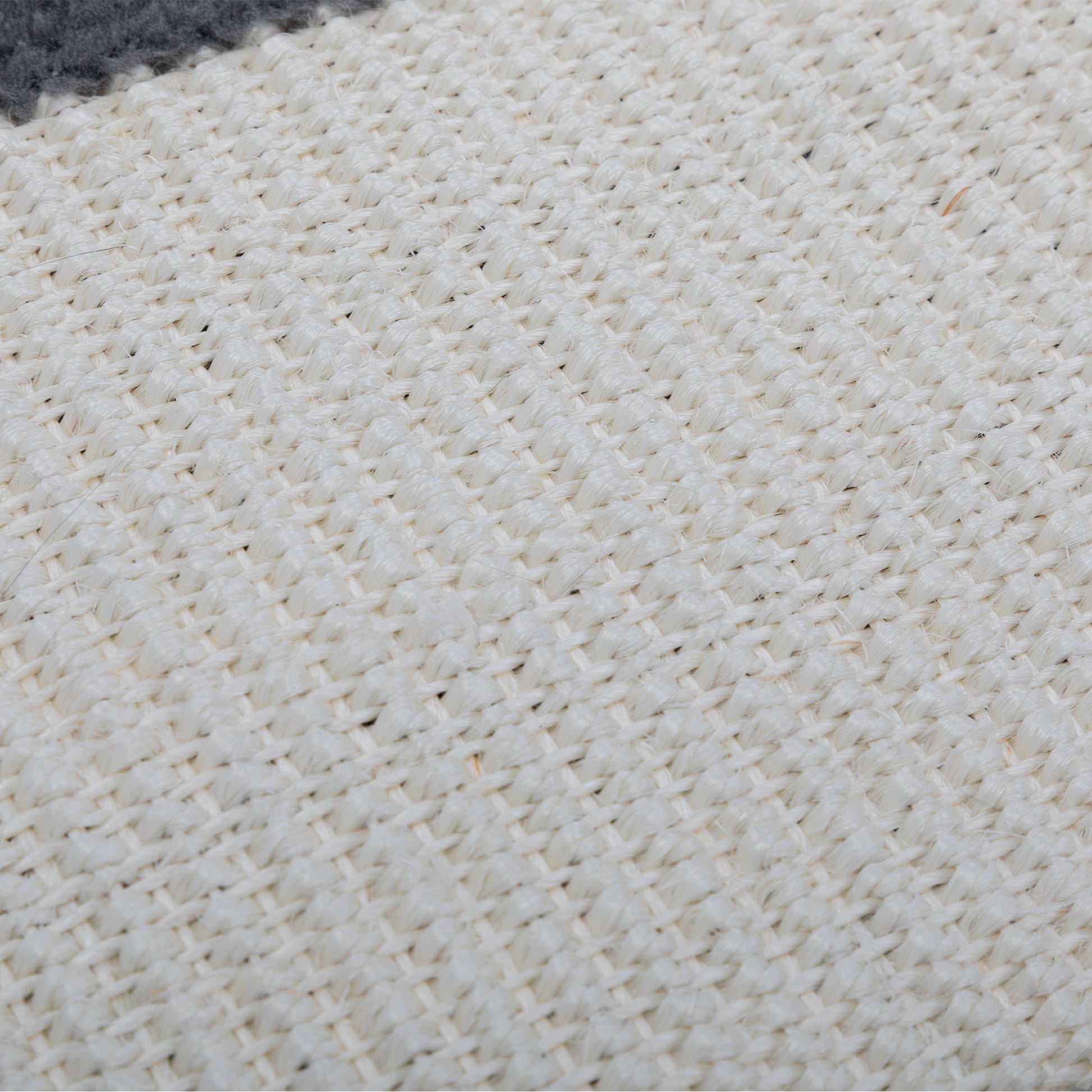 Close up of natural fiber rug texture in cream and gray