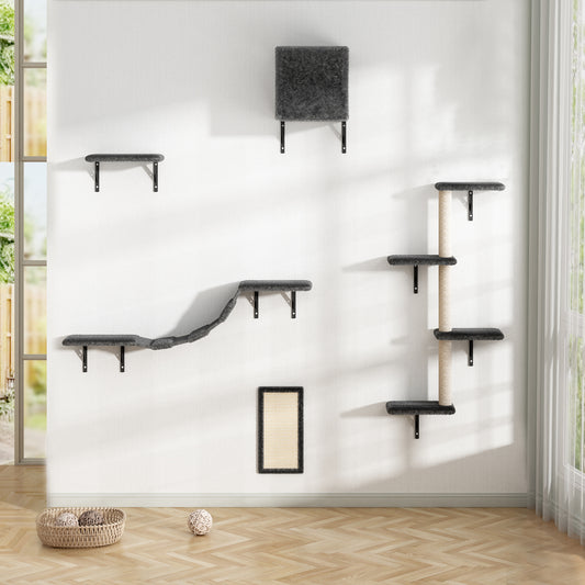 Gray modular cat shelves part of a climbing wall system