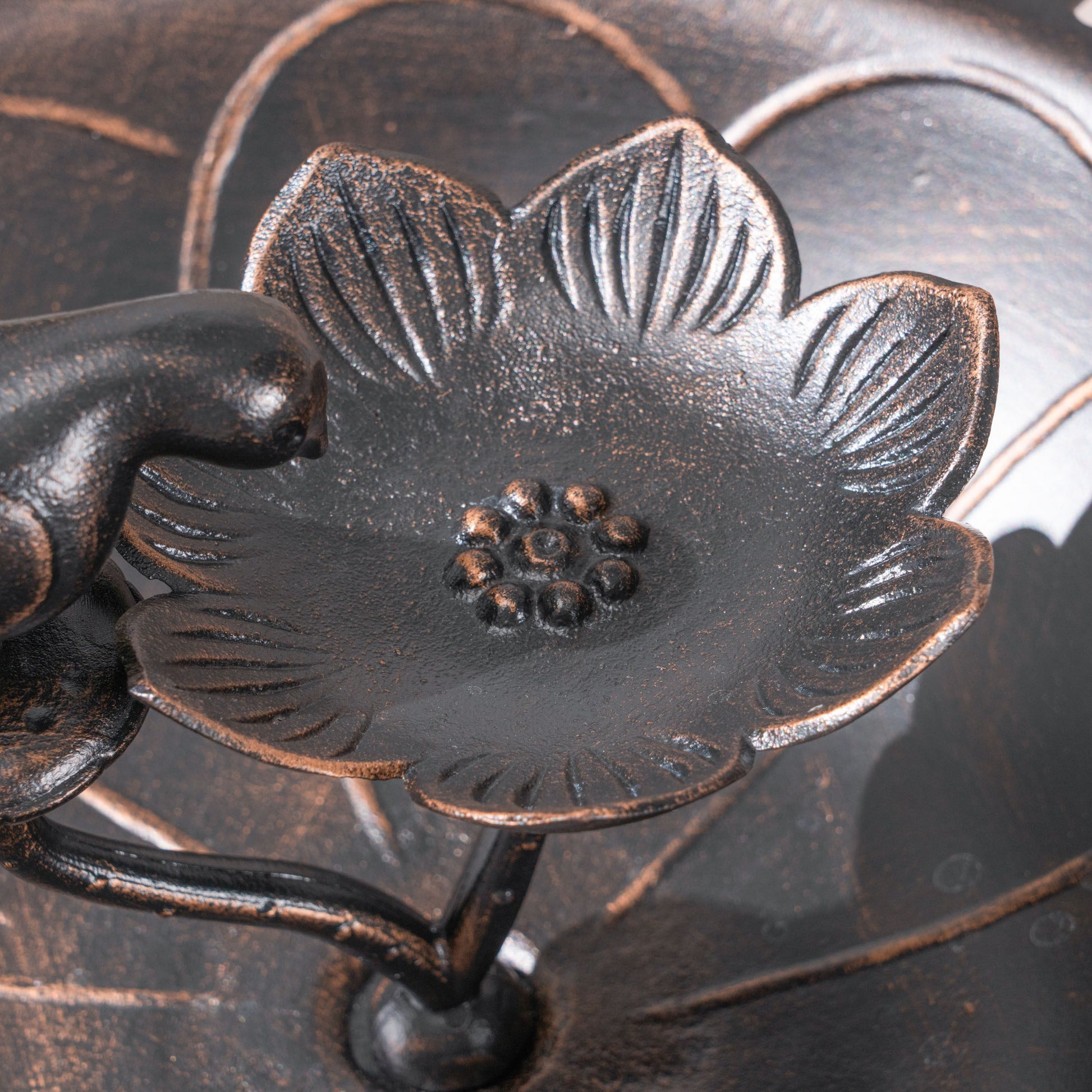 Antique bronze metal bird feeder with floral accents
