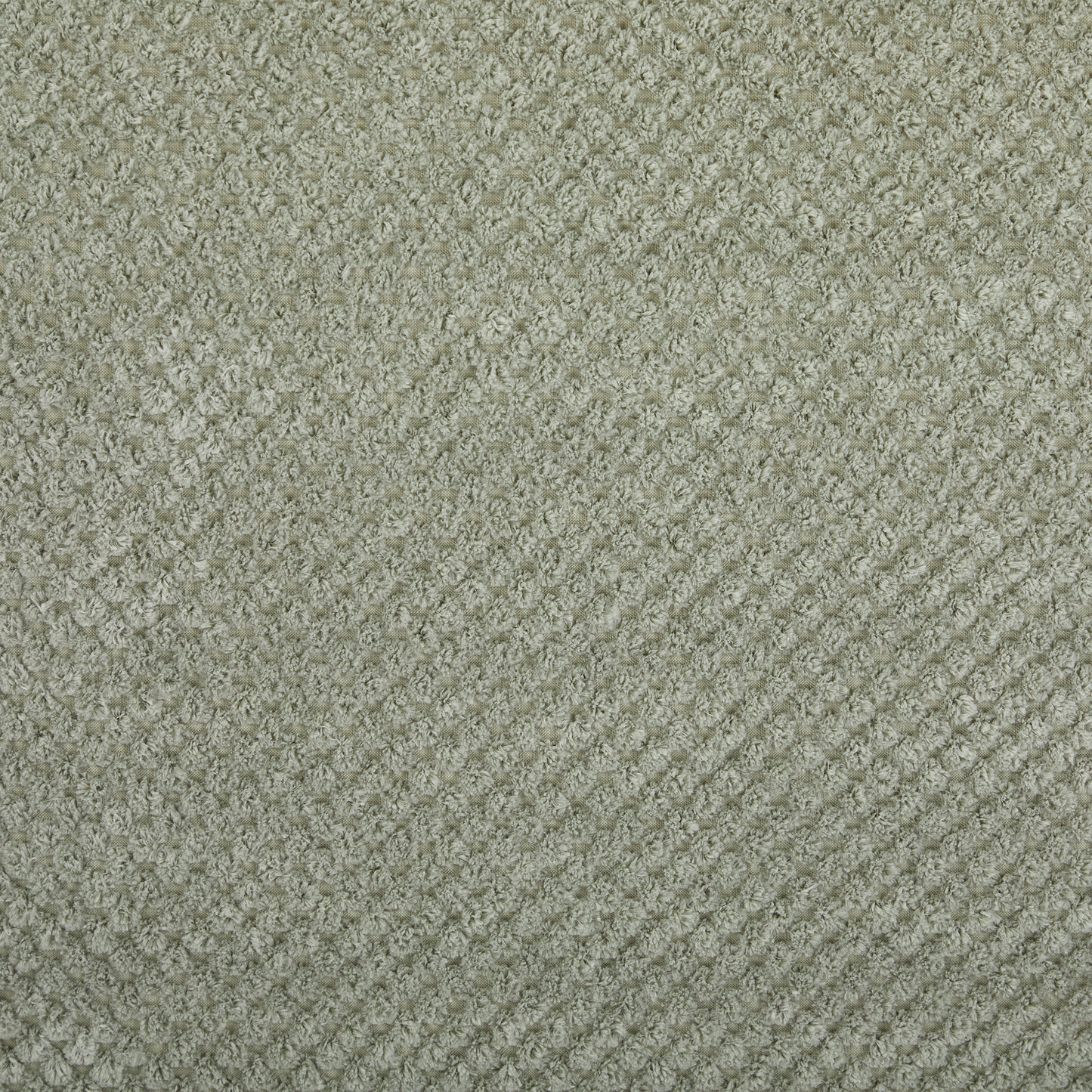 Light grey textured fabric with a chenille weave perfect for upholstery