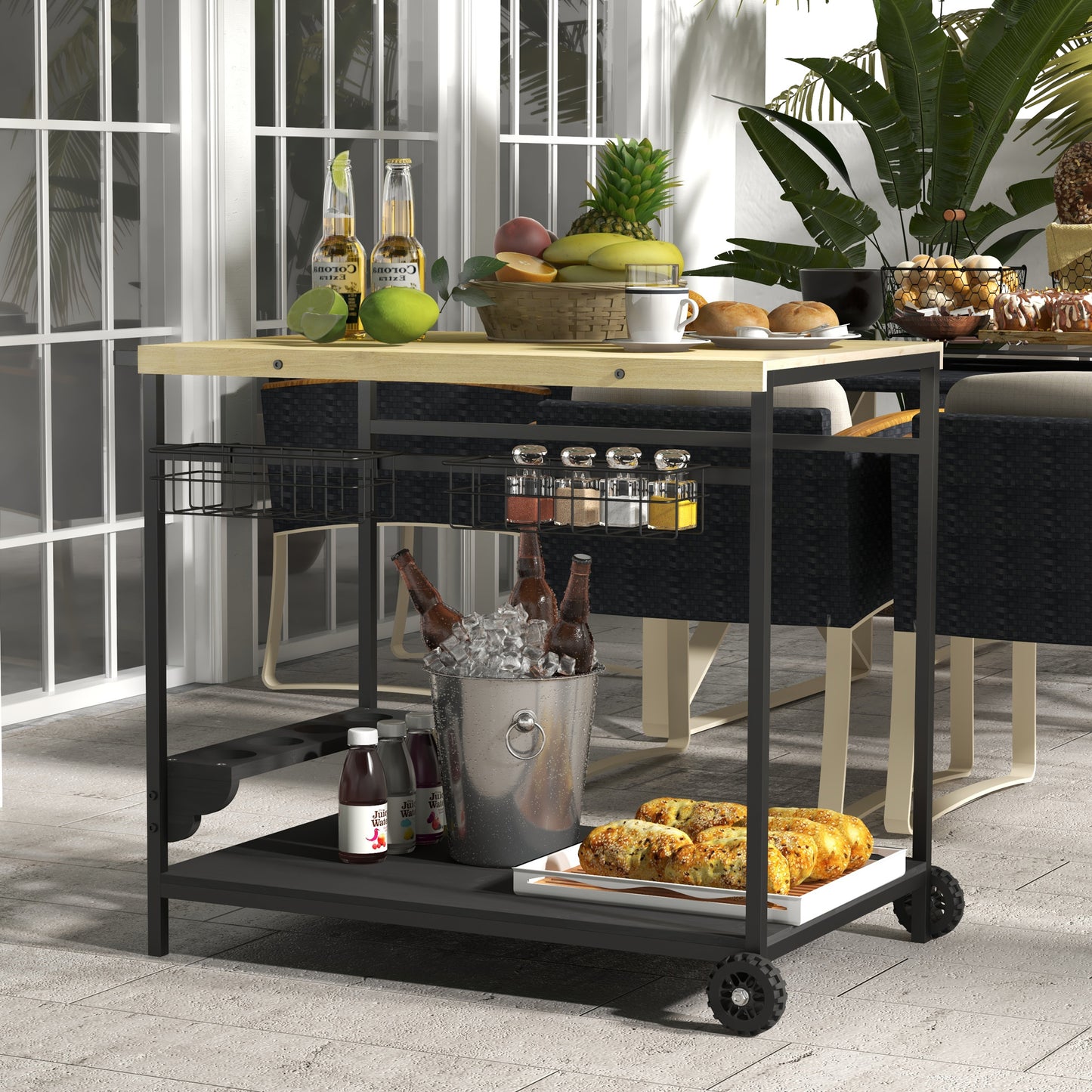 Black metal serving cart with light wood top holding drinks and food outdoors