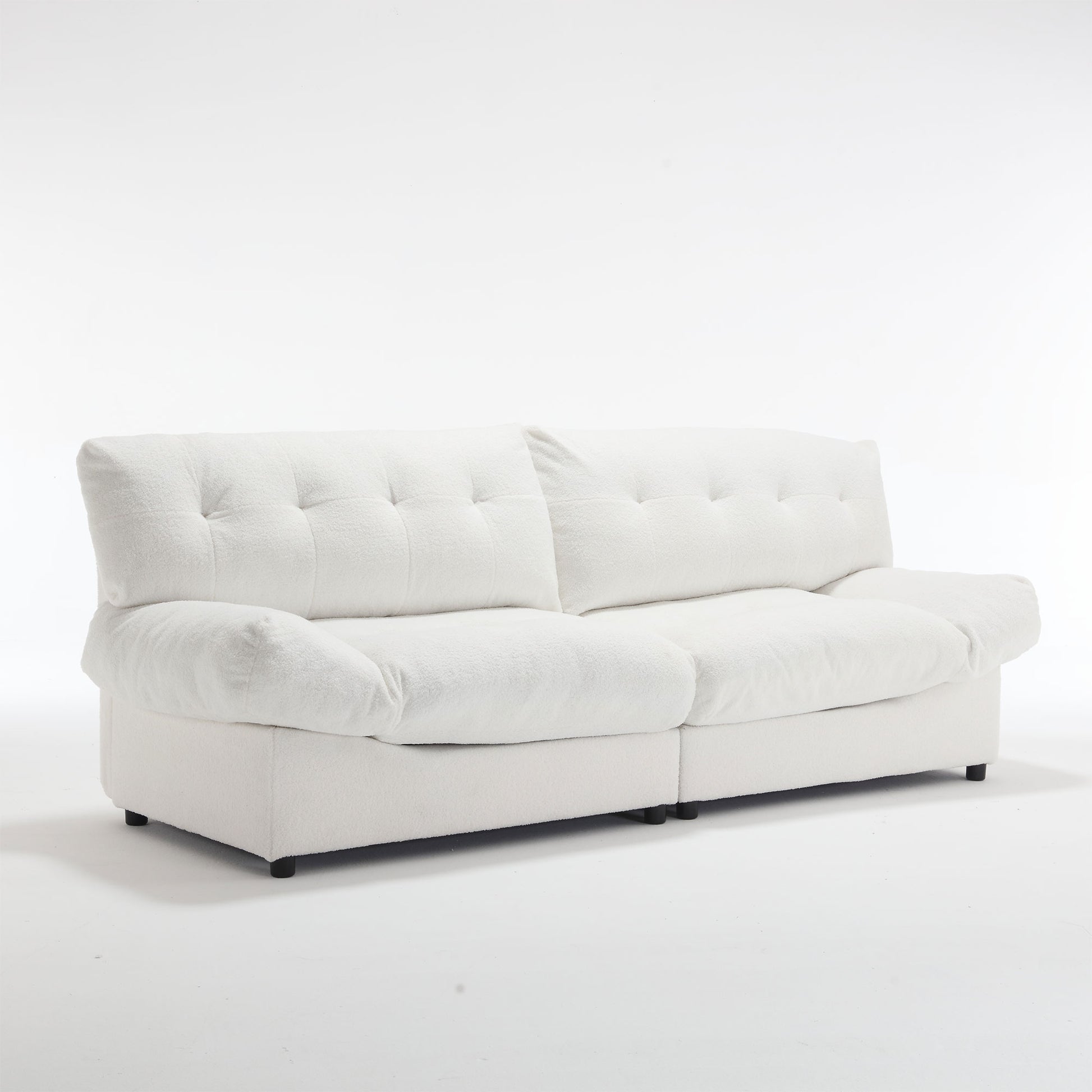 Plush white boucle fabric sofa with deep tufted cushions and rolled arms perfect for a modern living room
