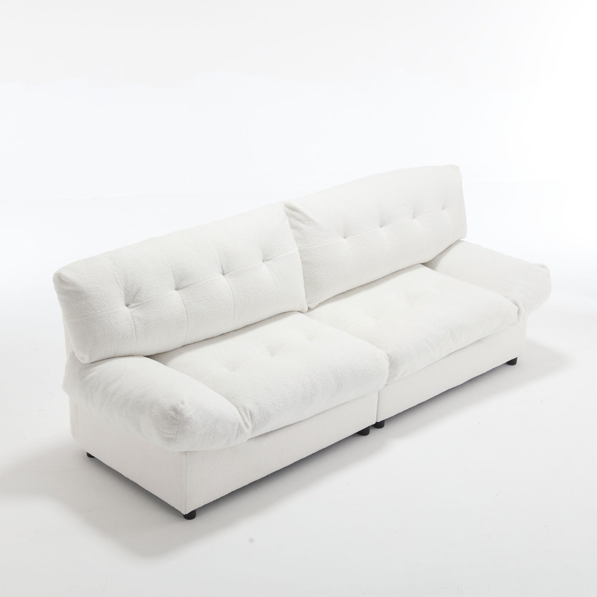 Plush white boucle fabric sofa with deep tufting on cushions perfect for modern living rooms