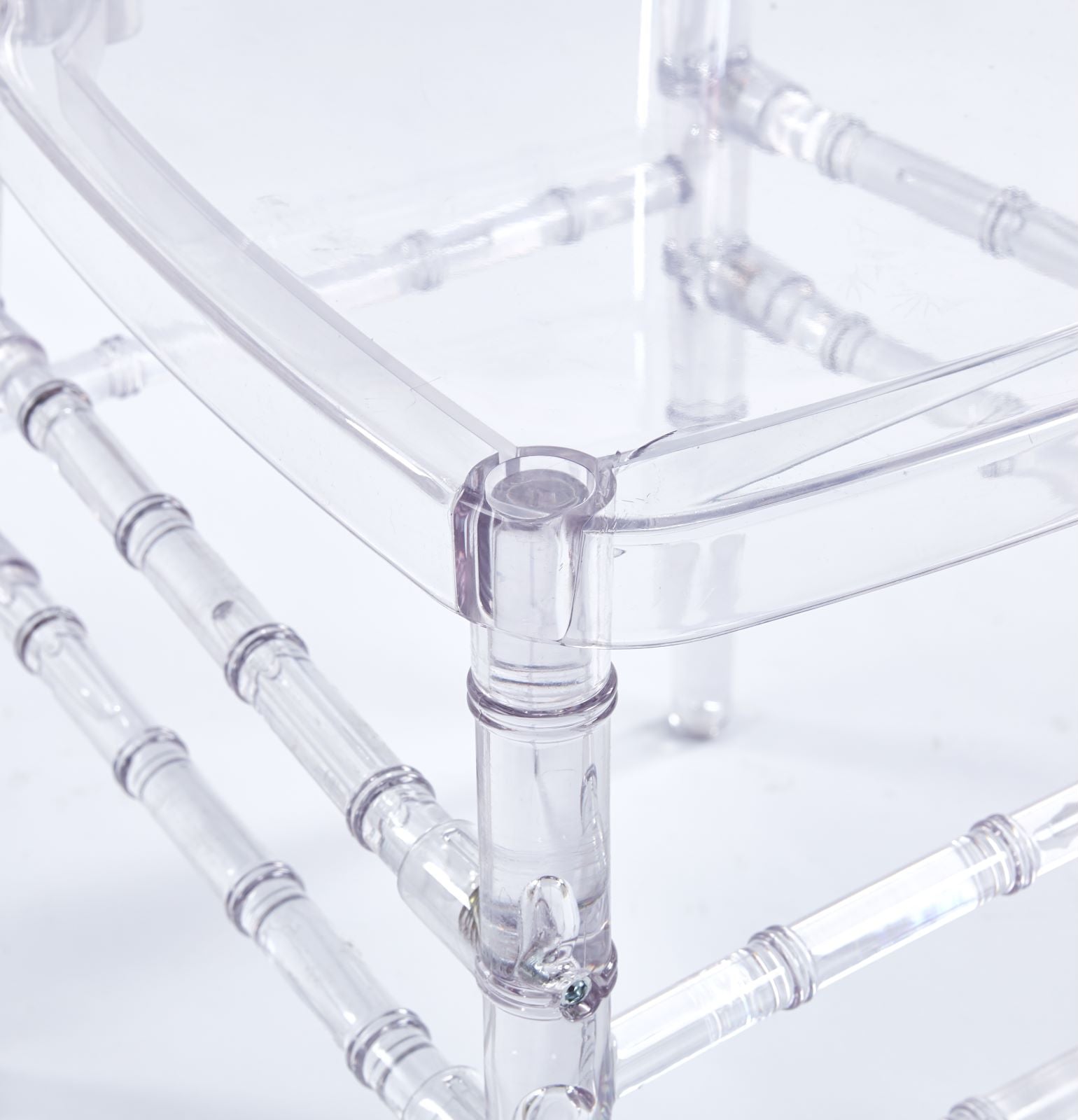 Clear acrylic chair legs with bamboolike detailing for a modern look